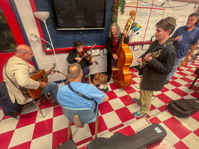 Jan Johansson warms up with his band at the 2025 Granite Quarry Fiddlers' Convention - photo © Sandy Hatley