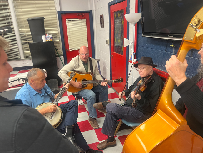 Jan Johansson warms up with his band at the 2025 Granite Quarry Fiddlers' Convention - photo © Sandy Hatley