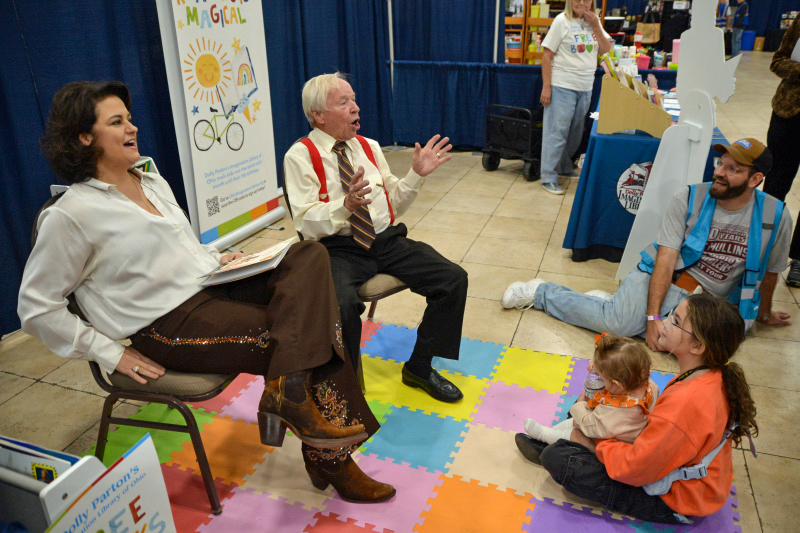 Lizzy Long and Little Roy Lewis read to kids at the November 2025 Industrial Strength Bluegrass Festival - photo © Bill Warren