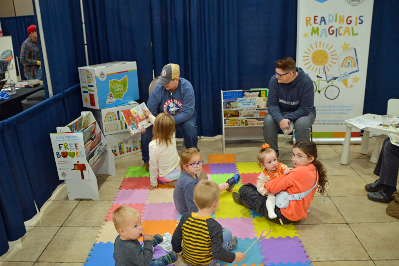 Marsha Channell and Michelle Lee read to kids at the November 2025 Industrial Strength Bluegrass Festival - photo © Bill Warren