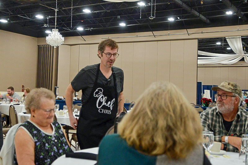 Chris Davis serving at the Saturday charity brunch at the November 2025 Industrial Strength Bluegrass Festival - photo © Bill Warren