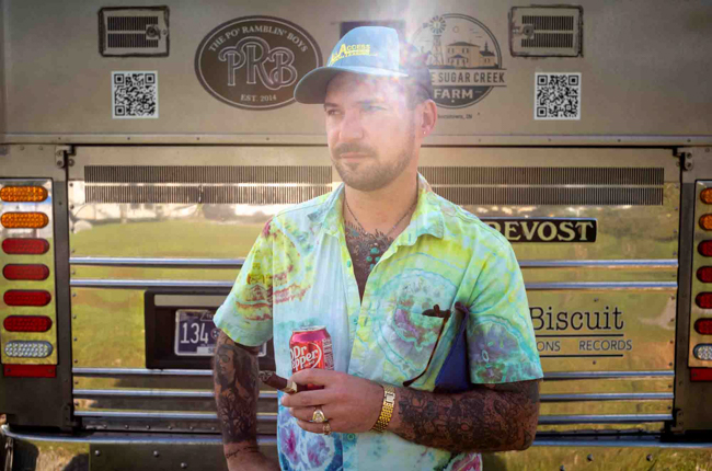 C.J. Lewandowski with The Po' Ramblin' Boys out by the bus at Pickin' in Parsons 2025 - photo © Jeromie Stephens
