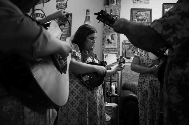 The Cox Family warming up backstage at Pickin' in Parsons 2025 - photo © Jeromie Stephens