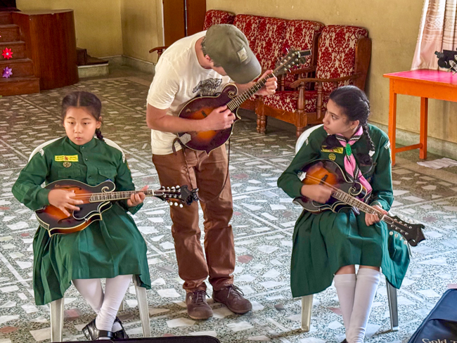Brett Kretzer teaching mandolin for the Bluegrass Journeymen Academy at Triyog High School in Kathmandu, Nepal.