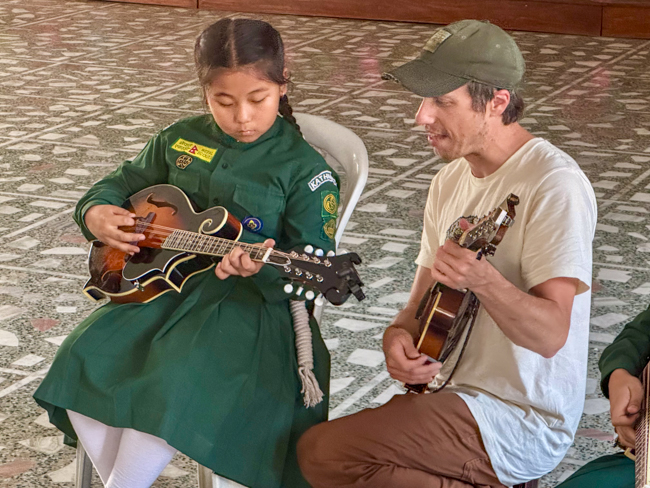 Brett Kretzer teaching mandolin for the Bluegrass Journeymen Academy at Triyog High School in Kathmandu, Nepal.