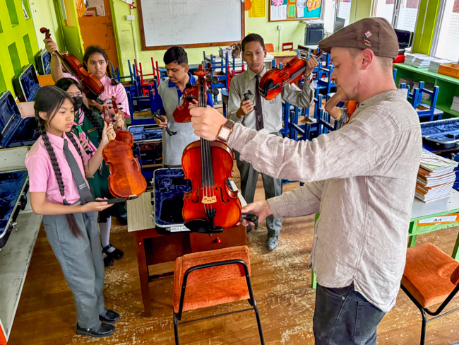 Ben Errington teaching fiddle for the Bluegrass Journeymen Academy at Triyog High School in Kathmandu, Nepal.